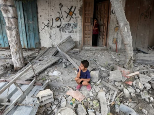 a palestinian boy sits at the site of an israeli strike on a house amid the israel hamas conflict in maghazi refugee camp in the central gaza strip august 14 2024 photo reuters a palestinian boy sits at the site of an israeli strike on a house amid the israel hamas conflict in maghazi refugee camp in the central gaza strip august 14 2024 photo reuters